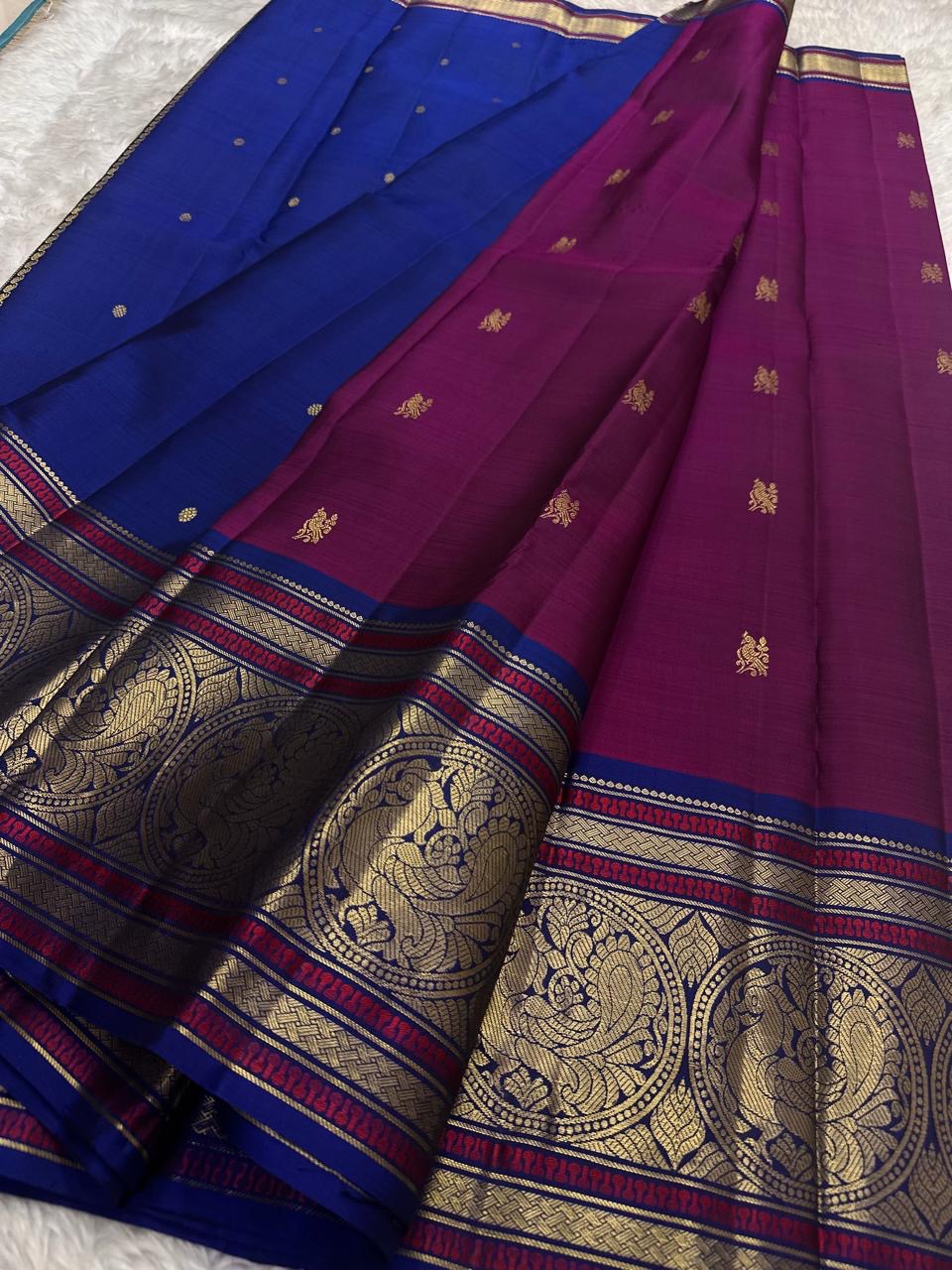 Pink Kanjeevaram silk saree with traditional gold zari close-up