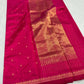 Luminous metallic gold-toned pallu of pink Chanderi saree