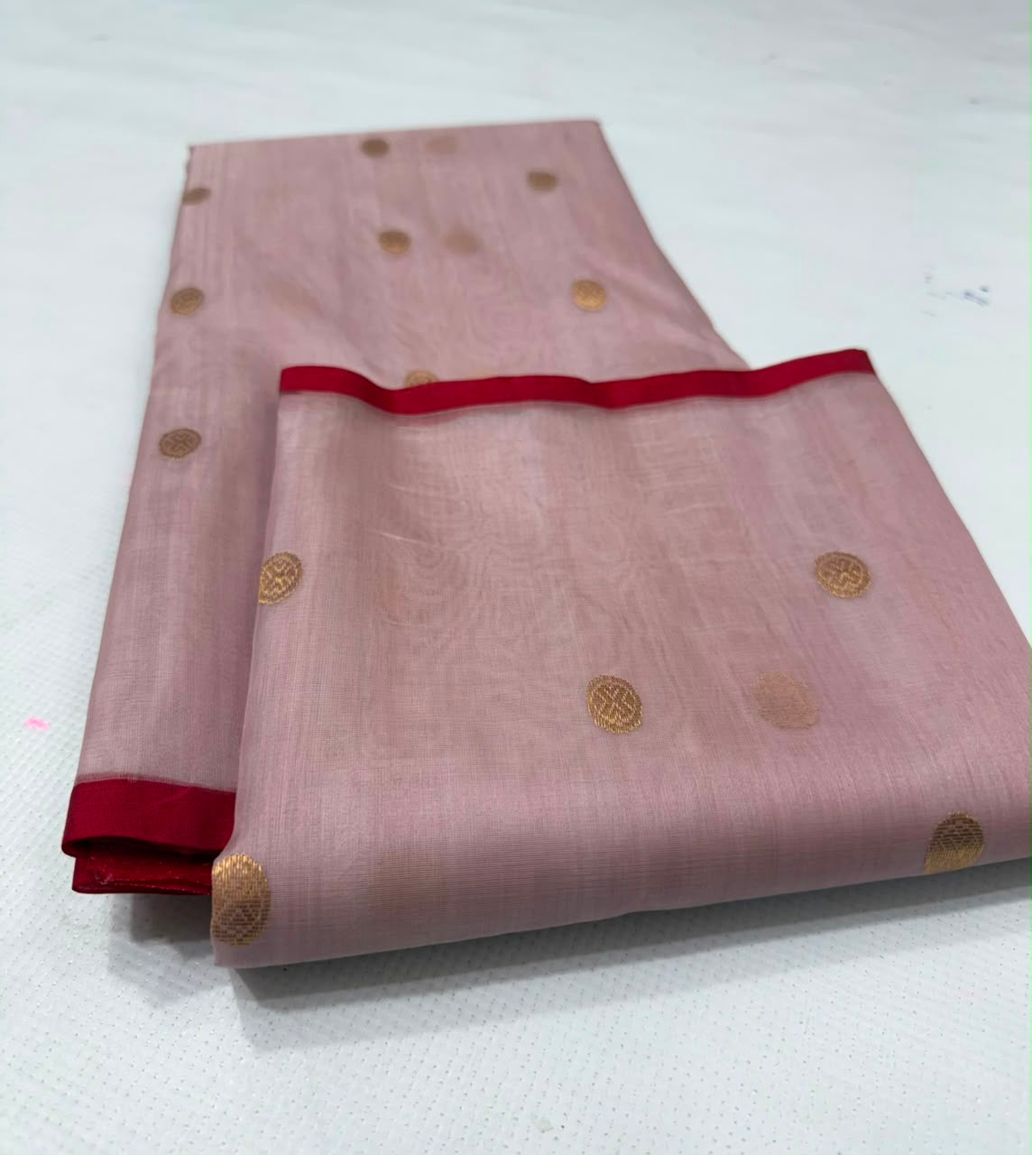 Close-up of the Deep Red contrast border on the Dusty Rose Katan Silk Chanderi saree