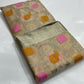 Pink and yellow woven floral accents on beige Chanderi silk