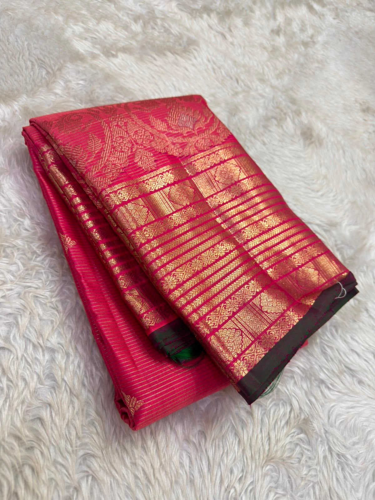 Raspberry Pink Kanchipuram silk with fine woven texture and gold zari motifs
