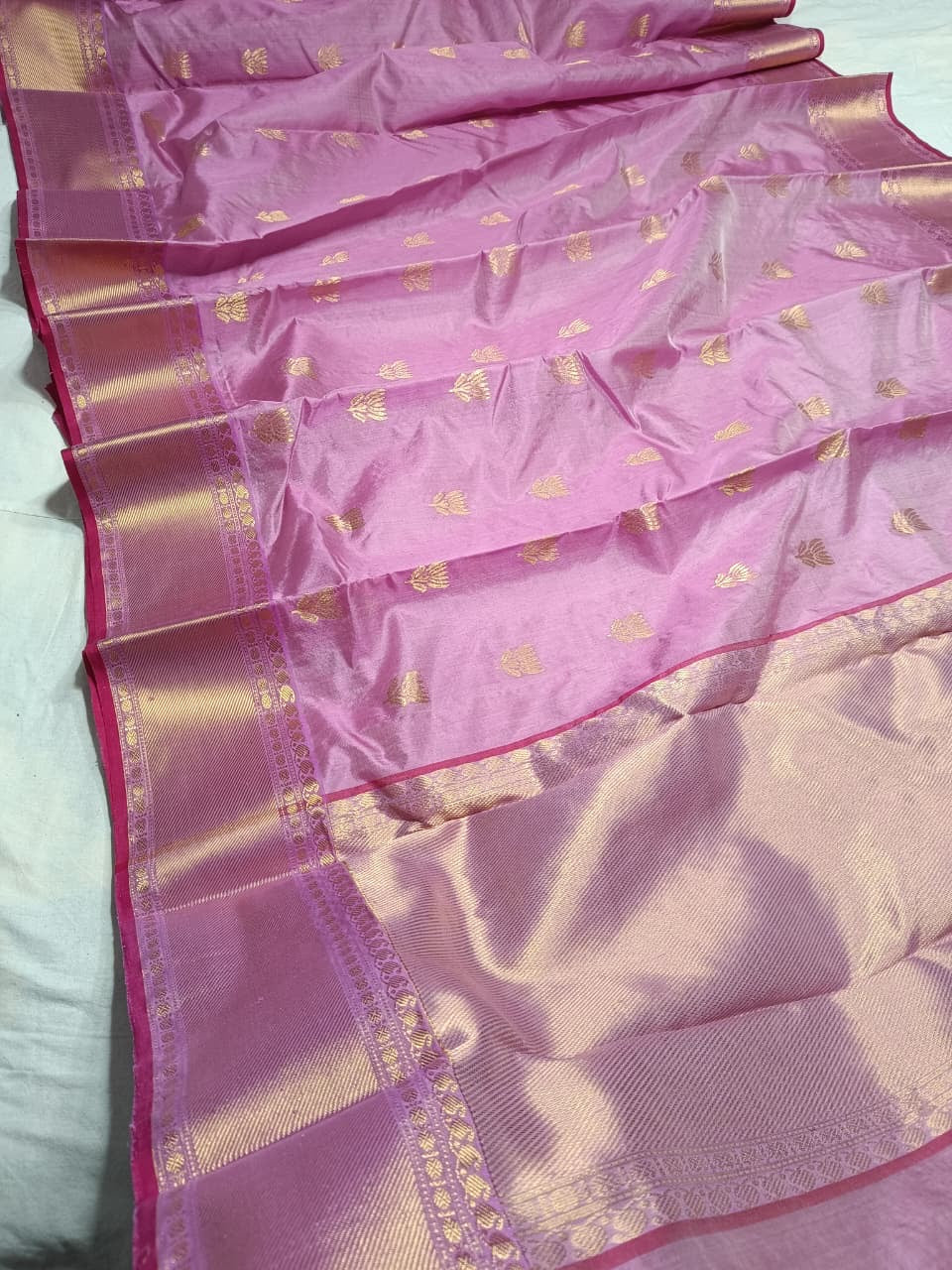 Detail of petite gold floral buttas on a Lavender Pink Pattu Silk Chanderi saree