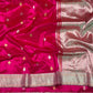 Close-up of scattered gold leaf buttas on the Rani Pink Pattu Silk Chanderi saree.