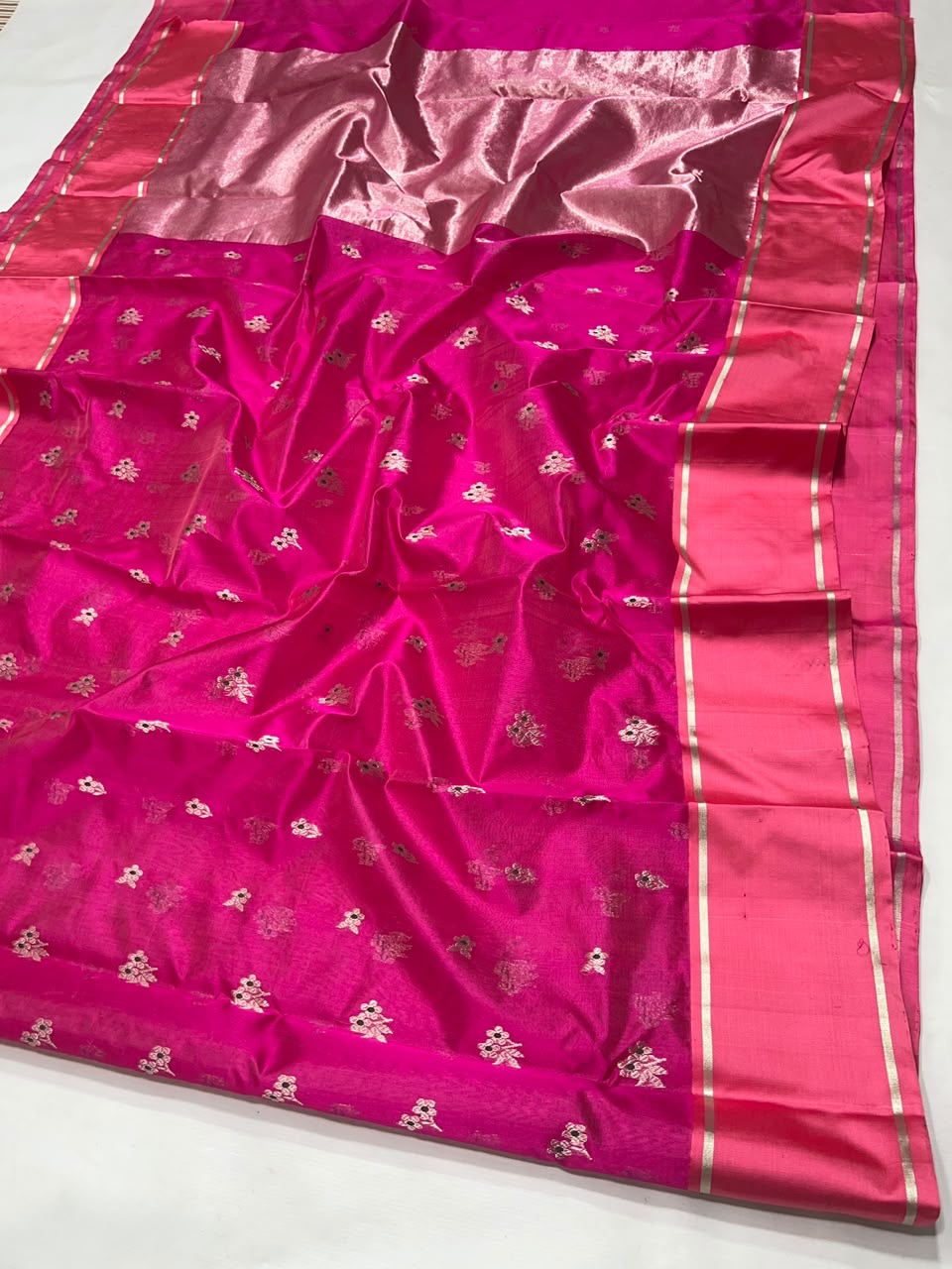 Bright pink Chanderi silk body close-up showing silver floral sprigs