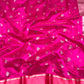 Silver floral sprig motif close-up on pink silk body