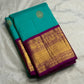 Close view of fine Vairaoosi striping woven through the vivid pink pure silk Kanchipuram body