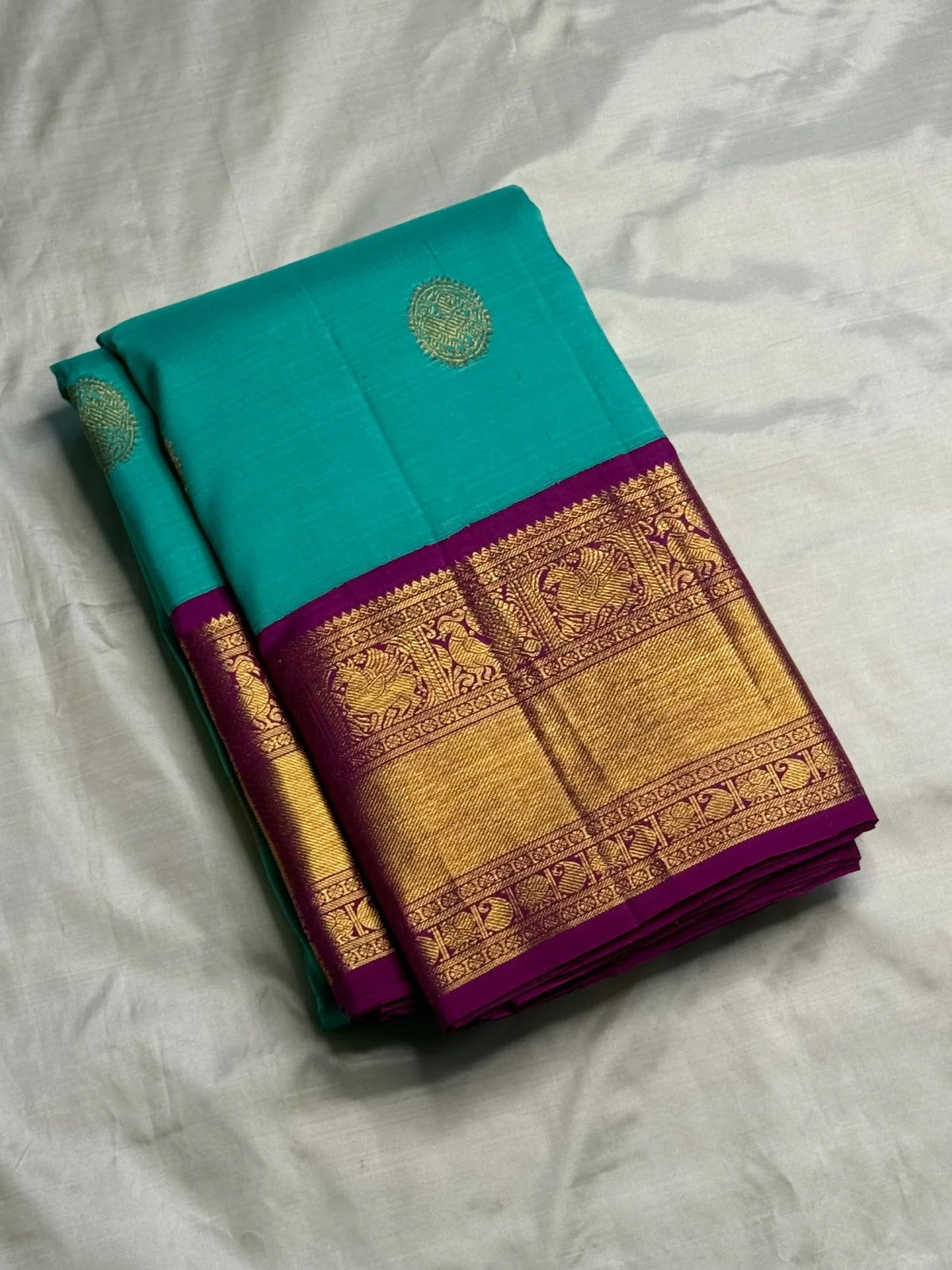 Close view of fine Vairaoosi striping woven through the vivid pink pure silk Kanchipuram body