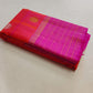 pink red kanchipuram silk saree draped on model with antique gold butta