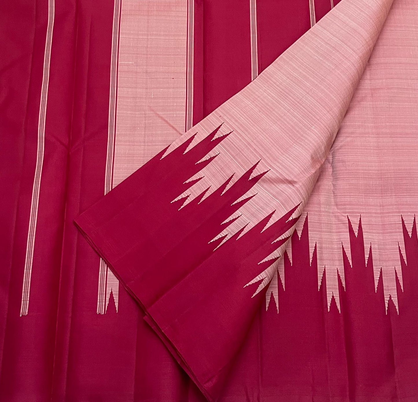 Scarlet red and pink Kanchipuram silk saree pallu section with linear woven details, available in the USA