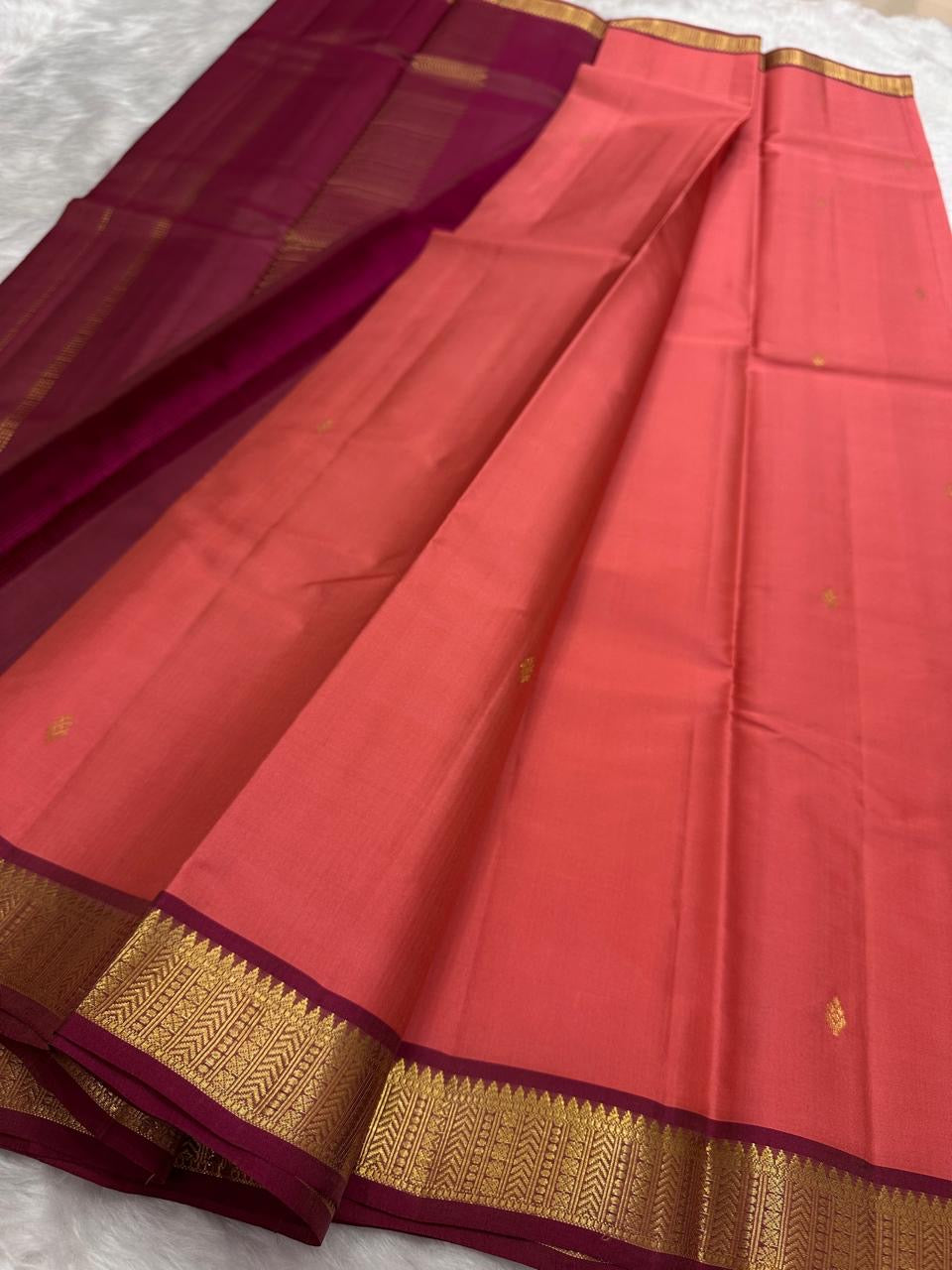 maroon pallu of pure kanchipuram silk saree with vertical gold zari pattern available in the USA