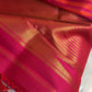 Handwoven pure silk Kanjivaram Ettukol saree in warm pink and orange.