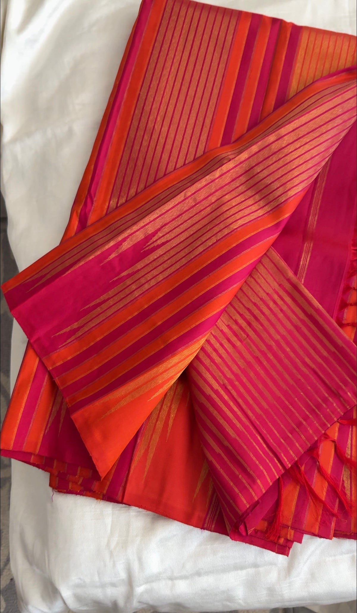 Antique-gold zari detailing on Pink Sunset Orange pure silk Kanjivaram.