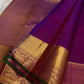 Close view of traditional Thazhampoo Reku zari butta on Rani Pink Kanchipuram silk.
