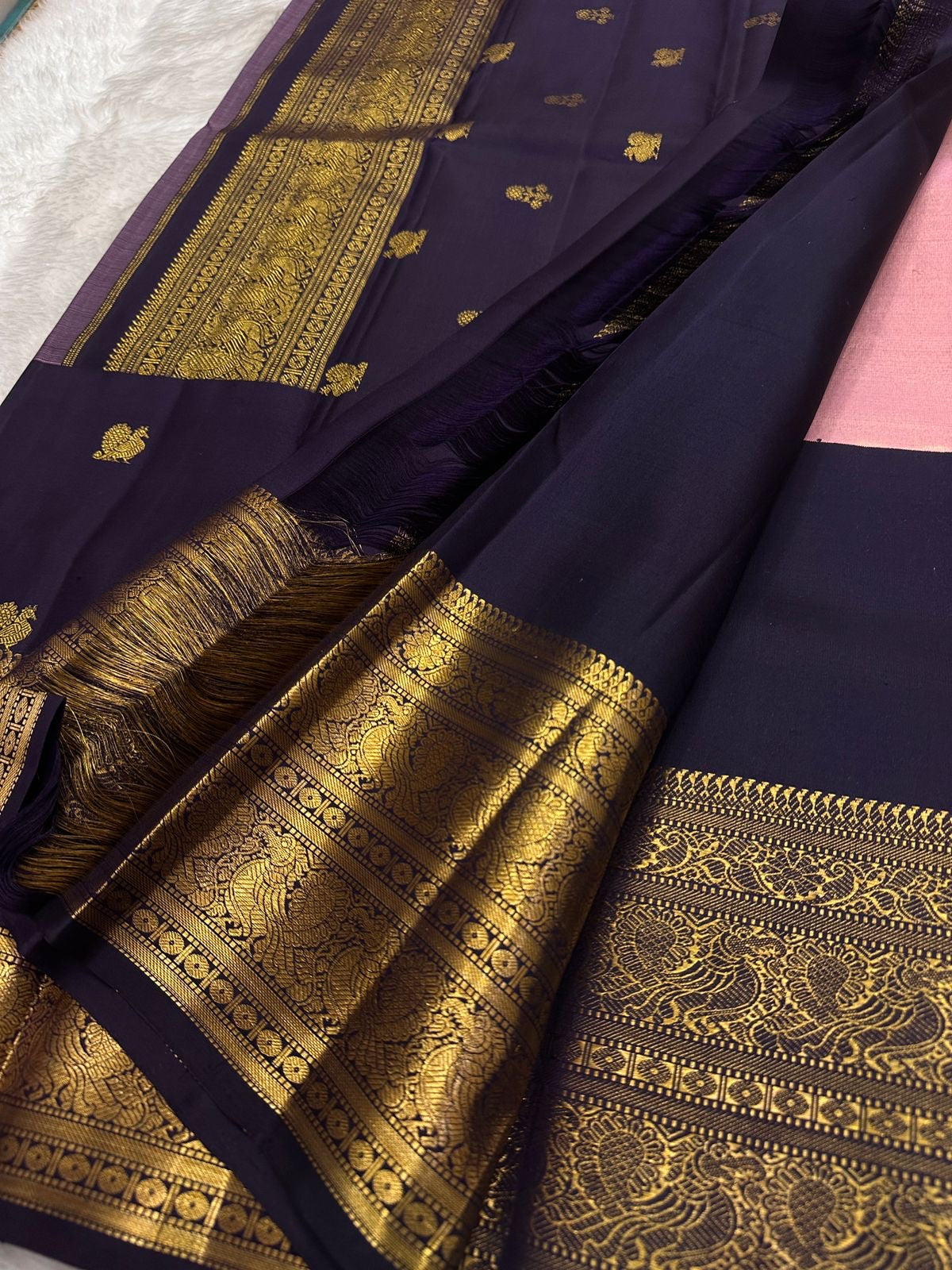 Pink tissue silk KanchiPattu Korvai saree, temple-style zari border detail