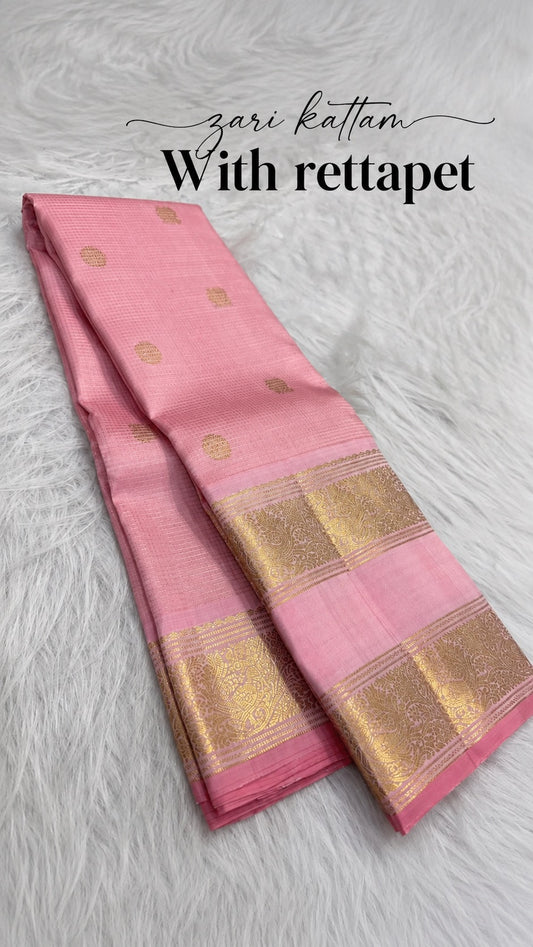 Blush pink Kanjipuram Zari Kattam Rettapet saree, folded flatlay