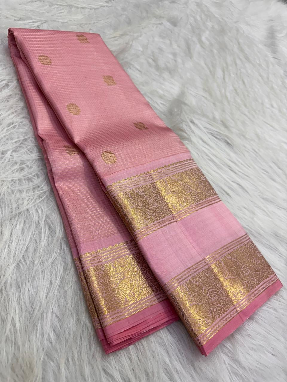 Blush pink Kanjipuram Zari Kattam Rettapet saree, folded view