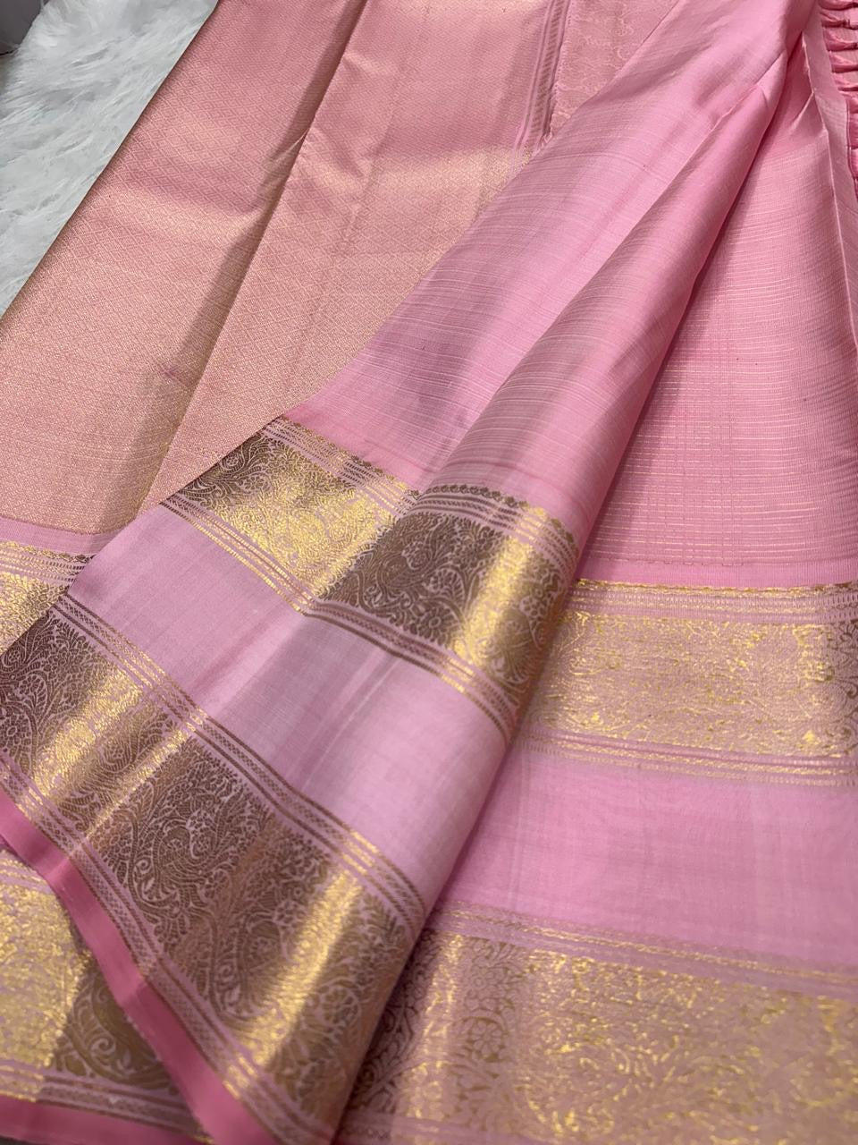 Gold zari butta detail on blush pink Kanjipuram Zari Kattam Rettapet saree