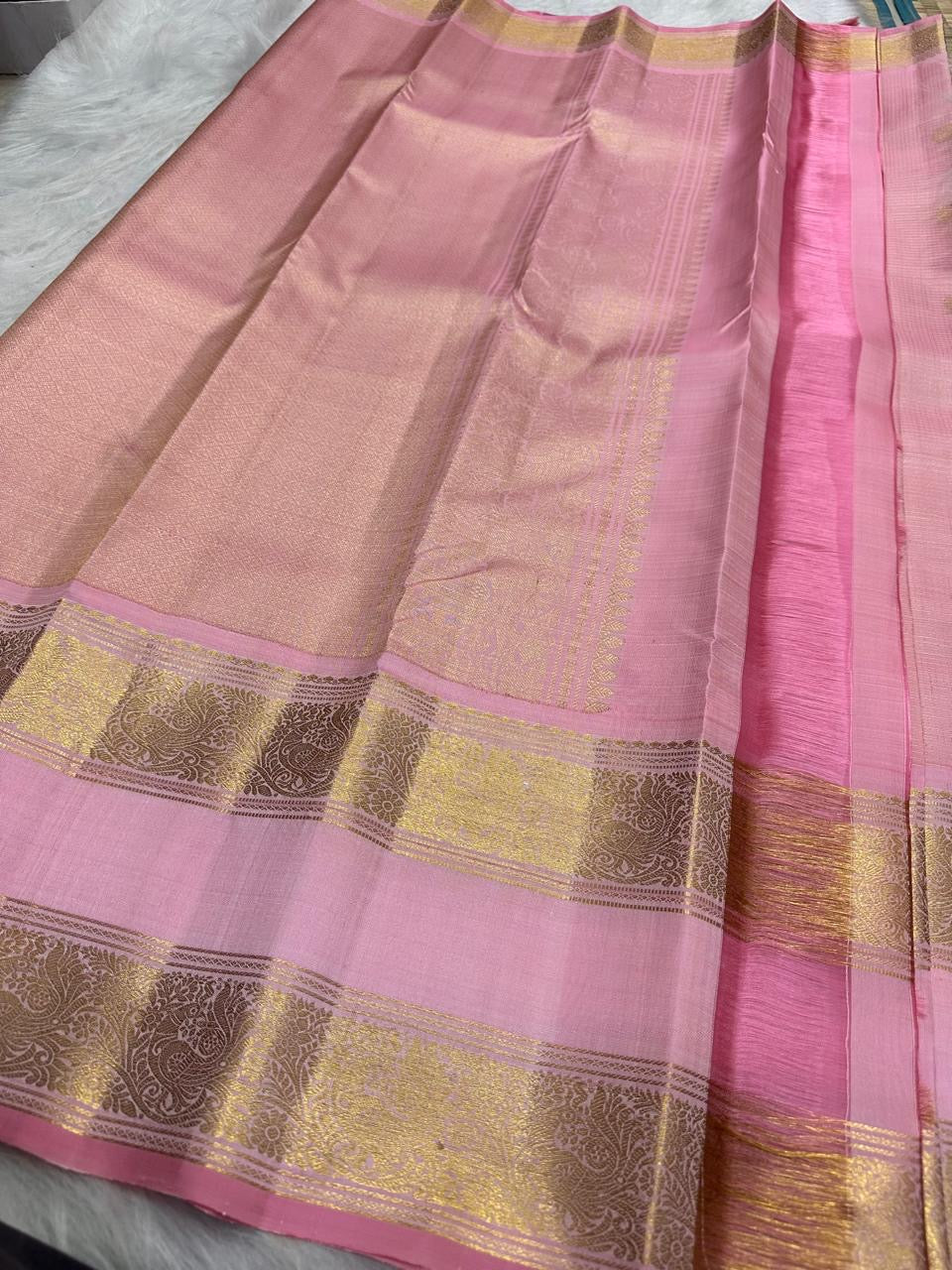 Pallu detail of blush pink Kanjipuram Zari Kattam Rettapet saree