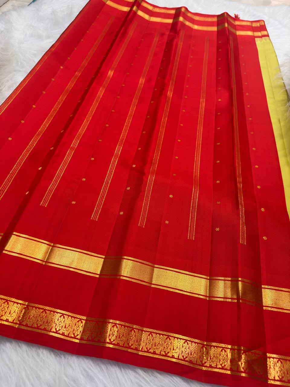 Kancheepuram pure silk rettapet border saree in golden radiant green with gopuram reku and buttas