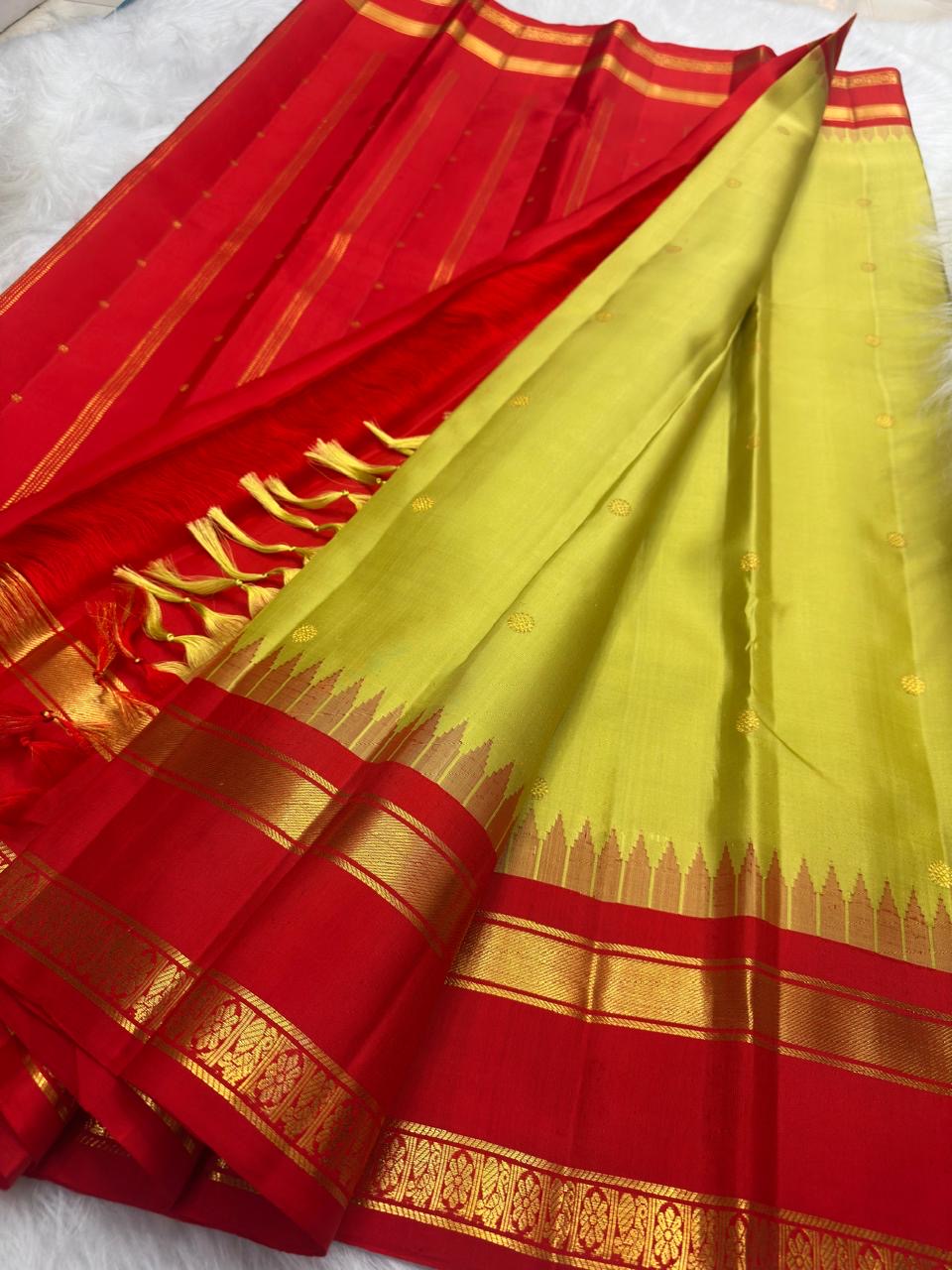 Golden radiant green pure silk Kanchipuram korvai saree with vermilion red rettapet border