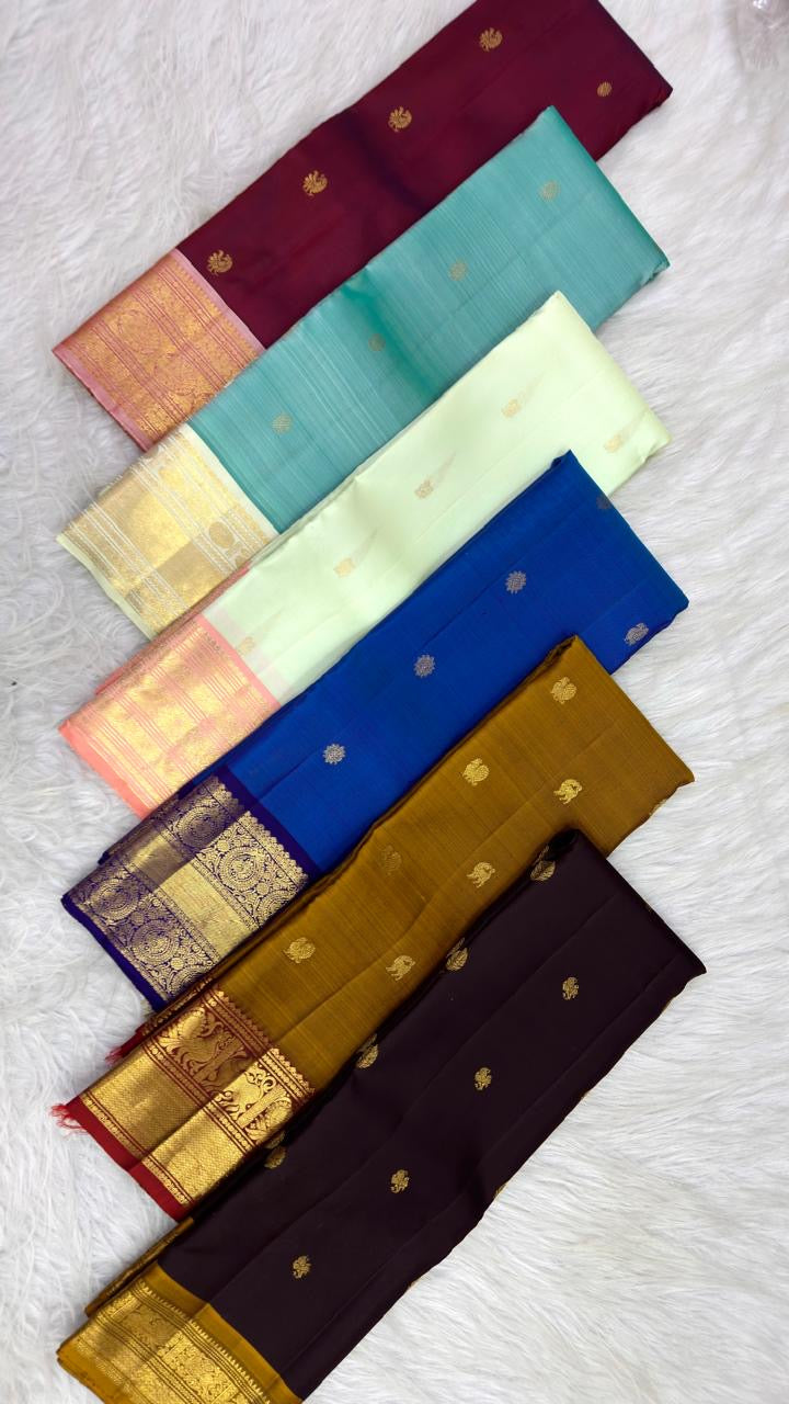 Lotus-petal peach Kanchipuram pallu with long varisai zari bands and alternating ornamental woven panels.
