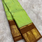 Pistachio Green and Chocolate Brown Handwoven Pure Silk KanchiPattu Saree with Kamalam Lotus Zari Border
