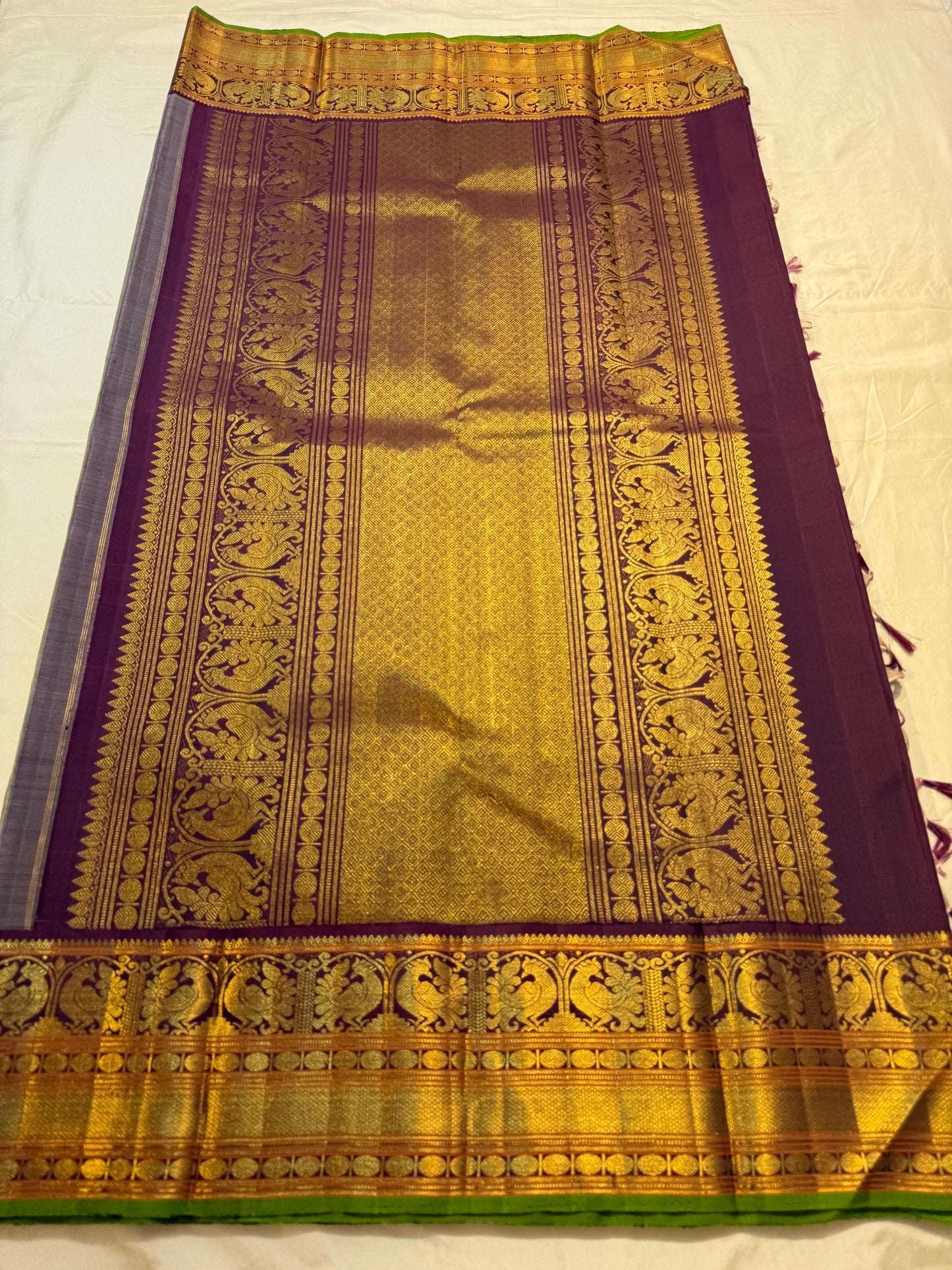 Folded view of pistachio green and deep purple korvai Kanchi Pattu silk saree — Idam Living