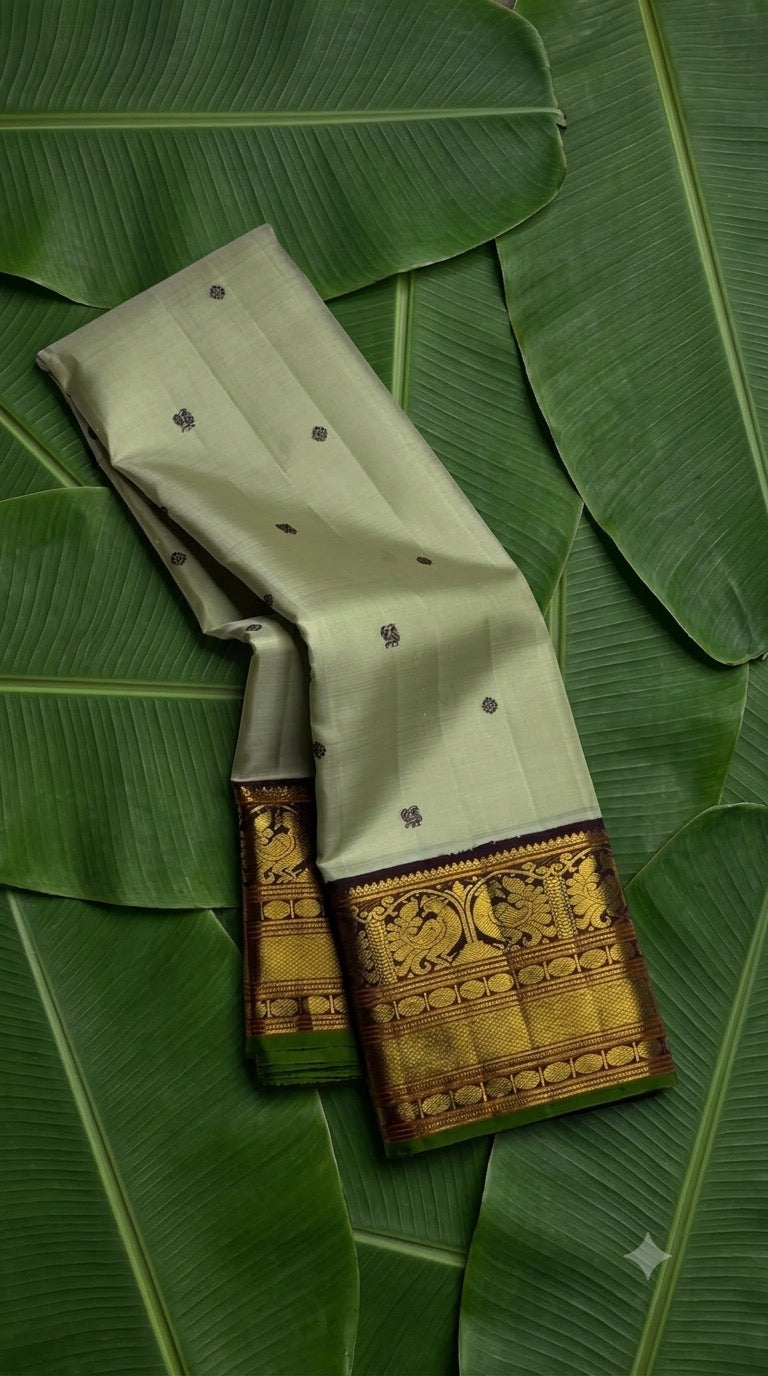 Pistachio green and deep purple korvai Kanchi Pattu silk saree with mayil chakram butta and Kanchana border — Idam Living