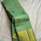 Pistachio-green Pure Silk Kanjipuram Butta saree with alternating Gandaberunda and paisley zari motifs.