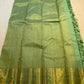 Green Pure Silk Kanchipuram saree showing elaborate gold-toned Gandaberunda and curved paisley motifs.