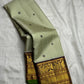 Handwoven pistachio green pure silk Kanchi Pattu saree with mayil chakram butta and deep purple border — Idam Living