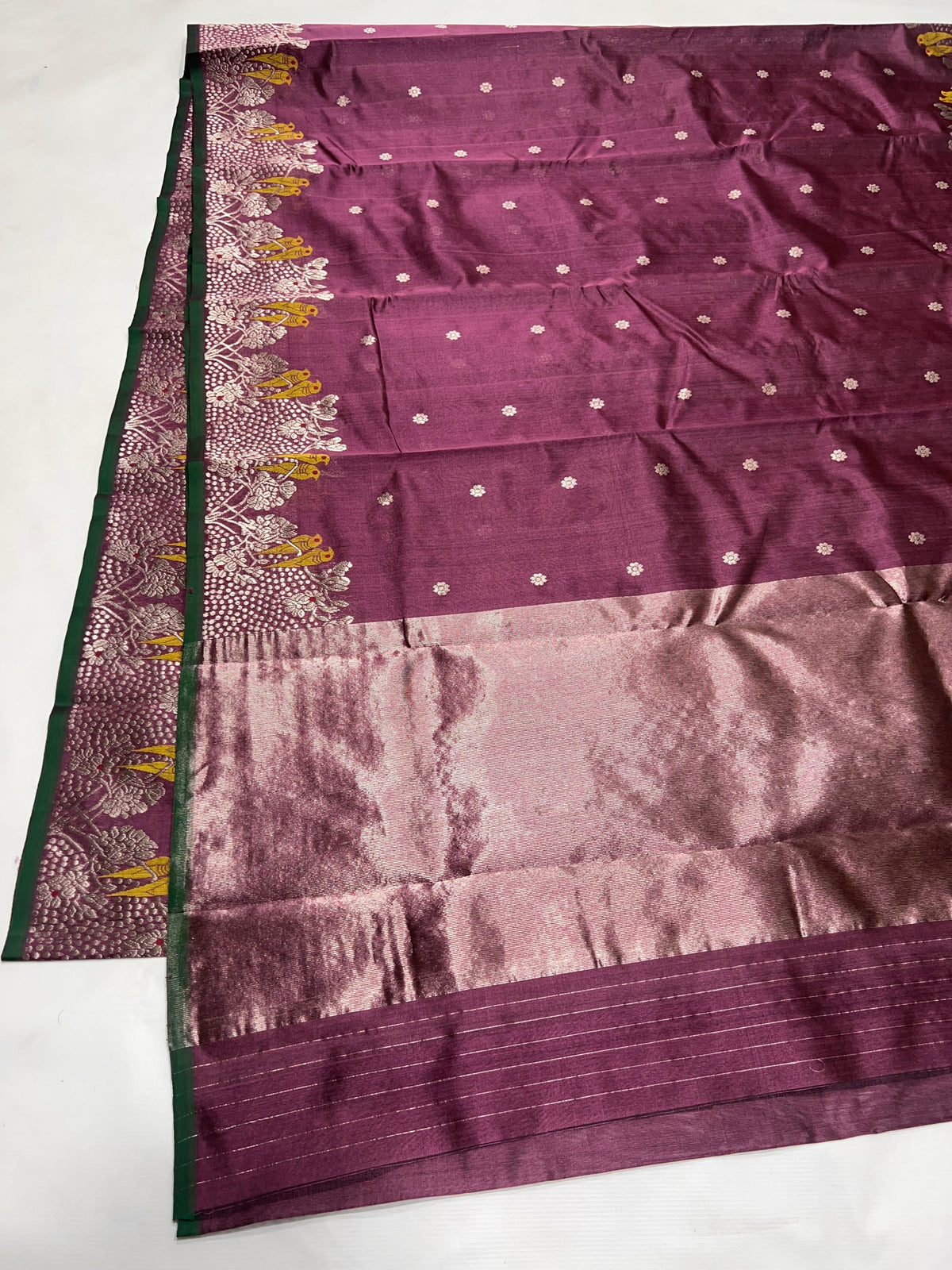 Plum Chanderi saree showing bird and foliage woven border
