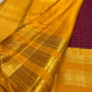 Plum purple body detail showing the zari kattam pattern and tiny gold buttas.