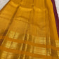 Close-up of tiny gold buttas within the plum purple zari kattam body.