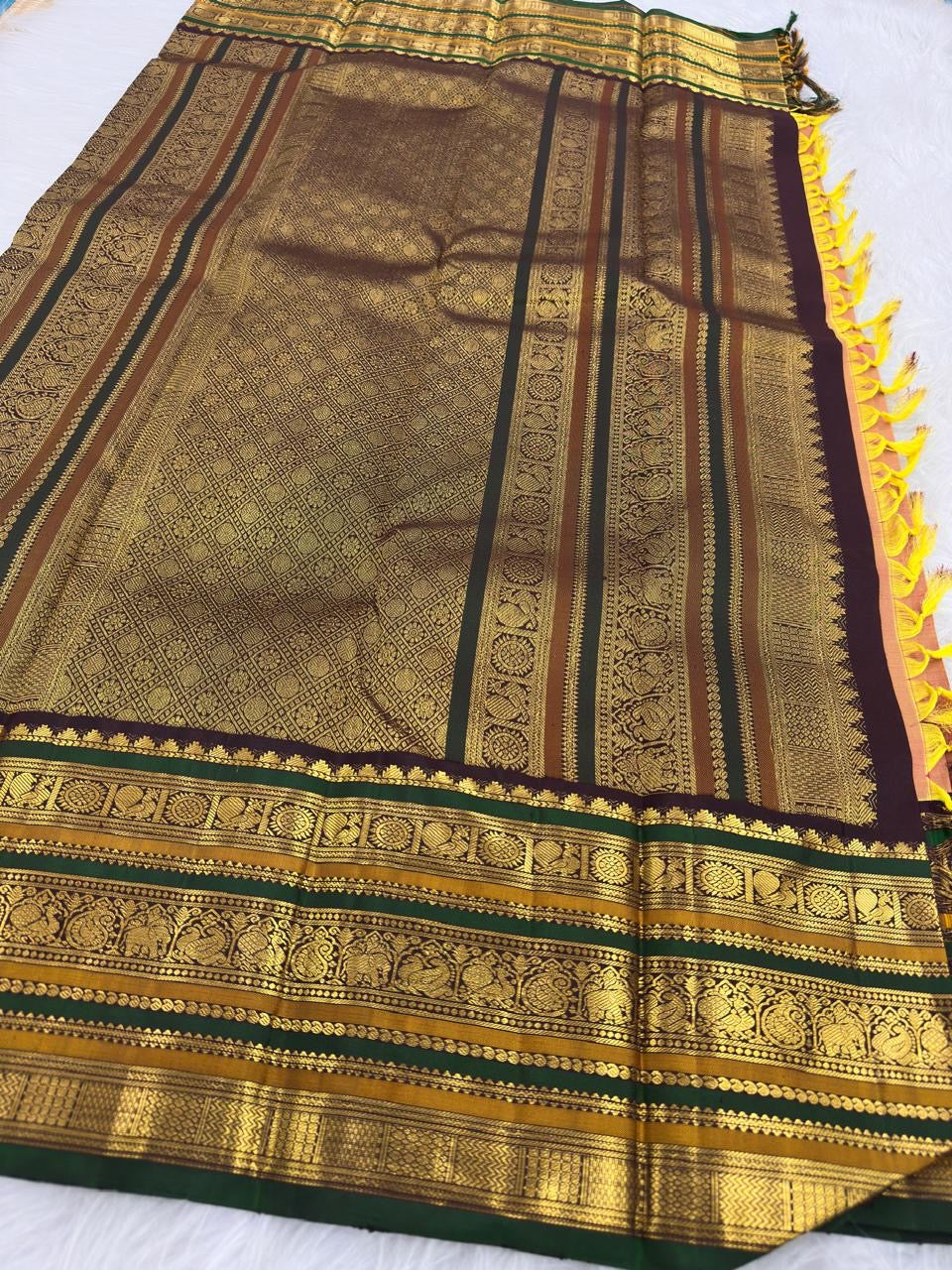 Close-up of Ponvandu antique gold shot-colour pure mulberry silk body with gold zari buttas