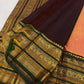 Full drape of Ponvandu antique gold Kanjivaram Varisaipet saree with emerald selvedge border