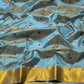 Powder blue Chanderi saree showing red floral butta detail