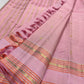 Soft pink Kanjipuram saree with delicate zari border