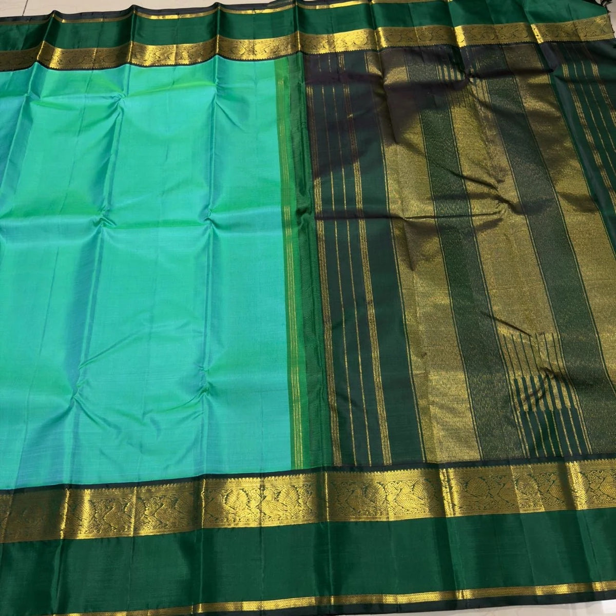 Light Green Handwoven Korvai Kanjivaram Silk Saree with Bottle Green Border
