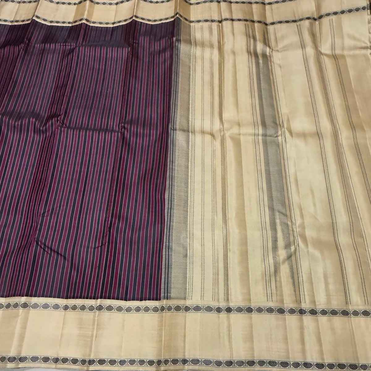 Close view of the body weave on the Maroon and Black Striped Premium Zariless Korvai Kanjivaram Saree with Off White Rettapet Rudraksham Borders.