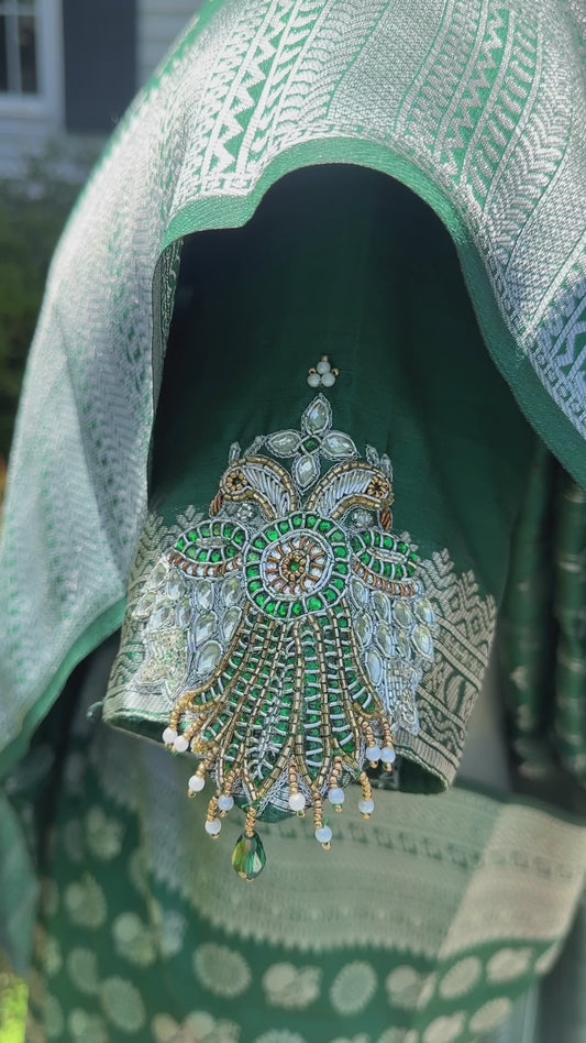 Green silver and gold Saree with peacock motif embroidery embellished with temple jewelry style stone work