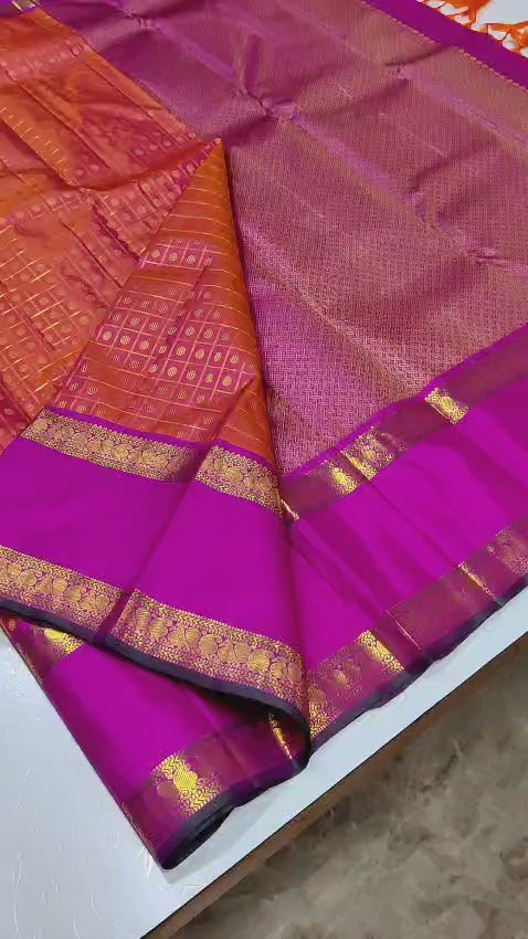 Ruby Orchid kattam – Pure Kanchipuram Silk Saree
Radiant red-orange body with fine kattam checks & zari buttas ✨
Striking magenta 2G Korvai borders woven with floral zari artistry

Silk Mark Certified, delivery in 2 weeks