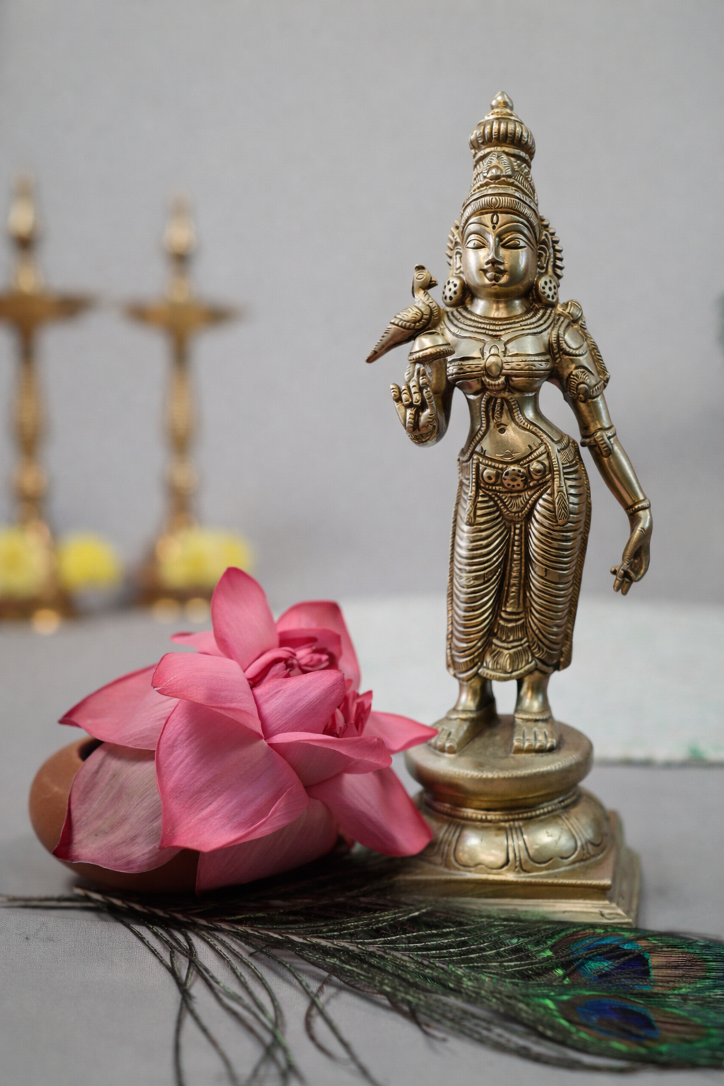Front view of 15.5 inch pure brass Madurai Meenakshi statue with detailed carving and parrot motif