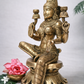 Front angled view of pure brass Lakshmi statue, 30 cm height, detailed crown, mudras and lotus pedestal, styled with pink lotus and jasmine flowers.