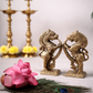 Pure solid brass Yazhi sculpture pair 5 inch height displayed with traditional brass kuthu vilakku lamps and floral bowl decor