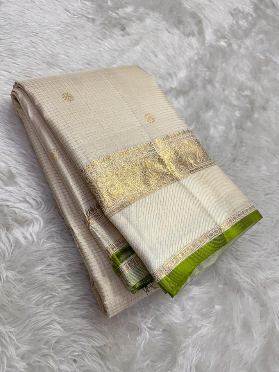Ivory silk saree with fine zari kattam grid and fresh green border