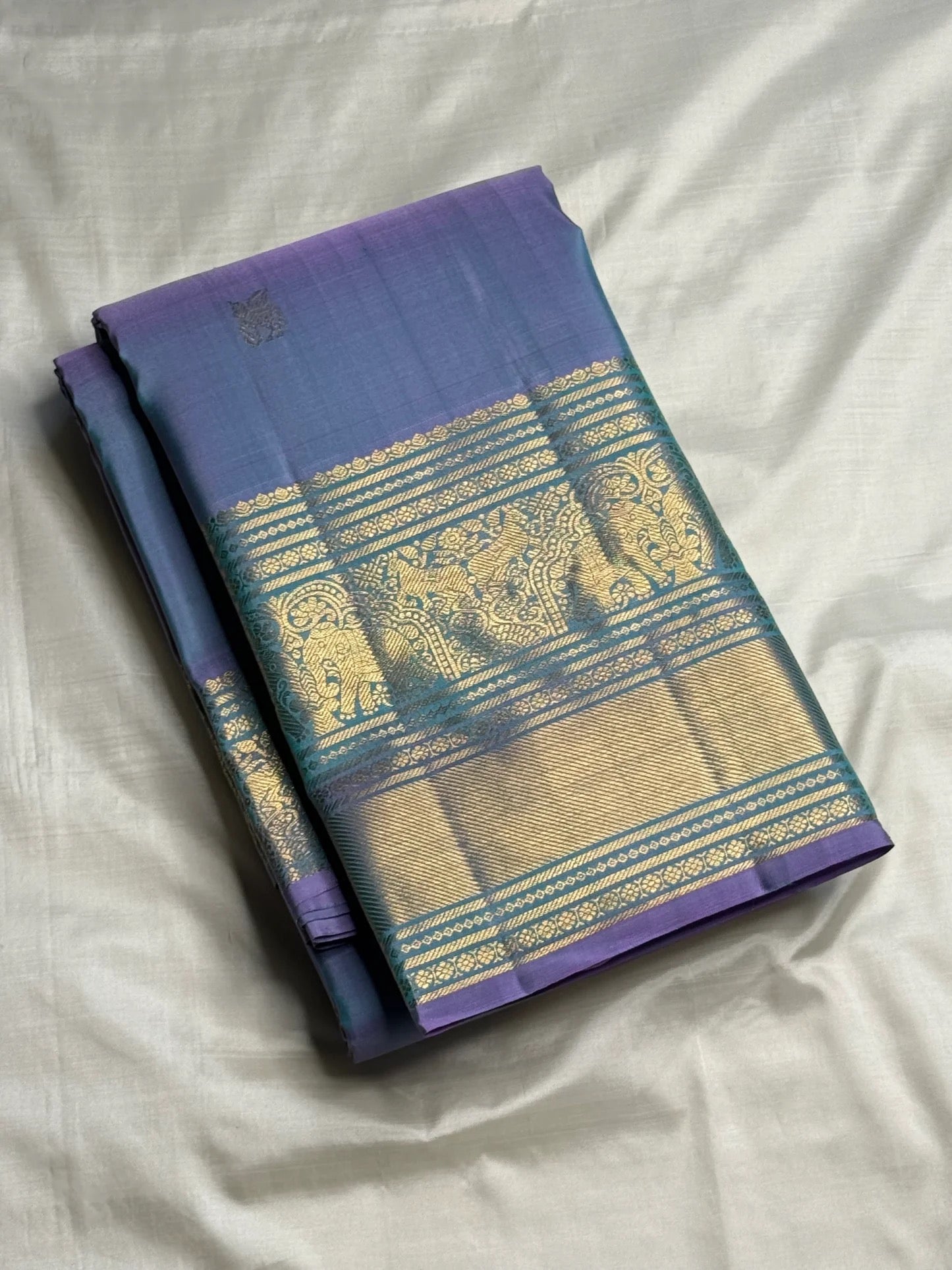 Close-up of rare Gandaberunda and winged horse gold zari buttas on Kanjivaram silk saree body