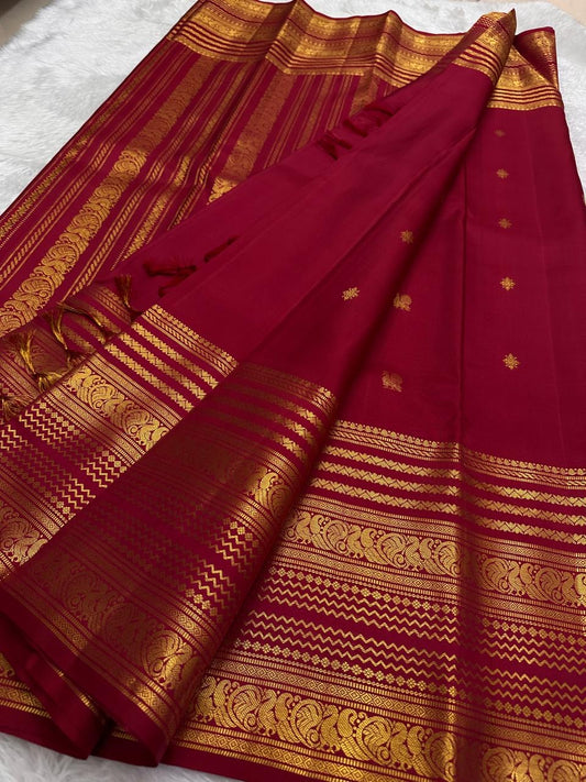 Handwoven Kanchipuram silk saree raspberry pinkish red body featuring antique gold varisaipet zari borders and elegant buttas
