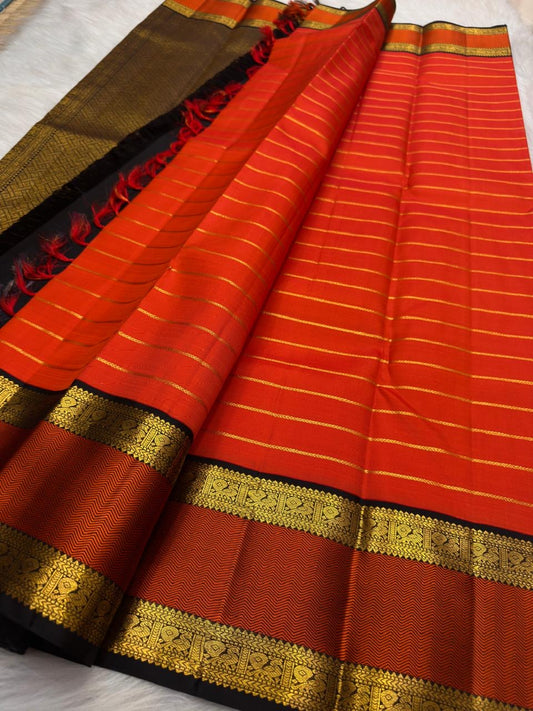 Vermilion Orange Handwoven Pure Silk KanchiPattu Saree with Rettapet Lines and Rust Manthulir Border