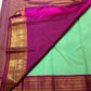 Body close-up of mint green Kanchi Pattu saree showing silk-thread buttas